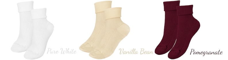 May include: Three pairs of ribbed socks in different colors: white, cream, and burgundy. The socks are folded down at the top, creating a cuffed look.