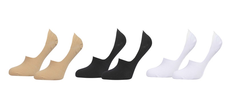 May include: A set of six pairs of no-show socks in beige, black, and white. The socks are made of a soft, breathable fabric and are designed to be worn with low-cut shoes.