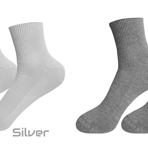May include: Two pairs of ankle socks, one pair is silver and the other pair is graphite.
