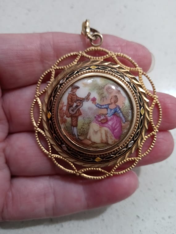 Vintage ceramic and gold tone pendant featuring an