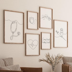 May include: Set of six black and white line art prints with medical themes. The prints feature a stethoscope, a heart with a heartbeat line, a syringe and vial, a medical bag, a heart with the text "Caring Hands, Healing Hearts", and two hearts with a line connecting them.