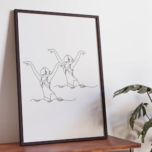 May include: A black framed print of a line drawing of two synchronised swimmers in the water.