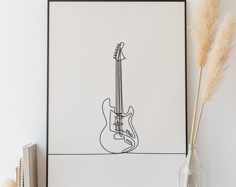 May include: Black and white line art print of an electric guitar in a black frame. The print is hanging on a white wall above a wooden dresser.