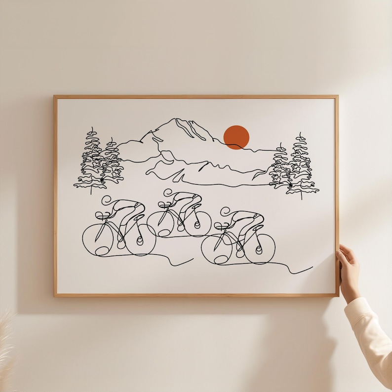 May include: A black and white line drawing of four cyclists riding through a mountain landscape. The cyclists are in a single file line, with the mountains and a red sun in the background.