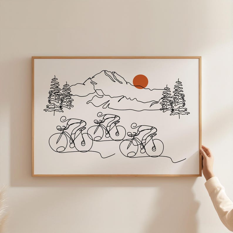 May include: A black and white line drawing of four cyclists riding through a mountain landscape. The cyclists are in a single file line, with the mountains and a red sun in the background.