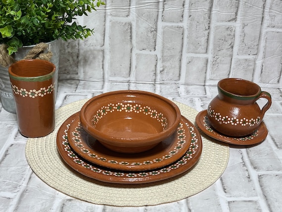 Nicaraguan terracotta ware, called barro, sit on a white table