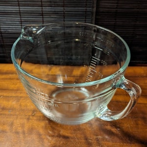 2 Vintage Anchor Hocking Advertising 5 oz. Measuring Cup Juice Glass