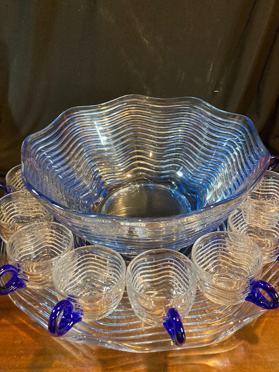 Twelve Blue Glass Bowls with Underplates Twelve Blue Glass Bowls with Underplates