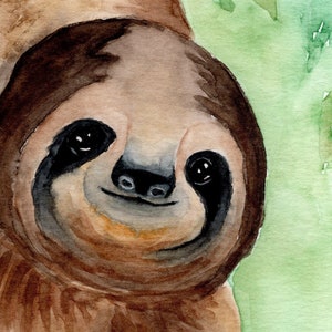May include: Watercolour painting of a brown sloth with black eyes and a happy expression. The sloth is surrounded by green leaves.