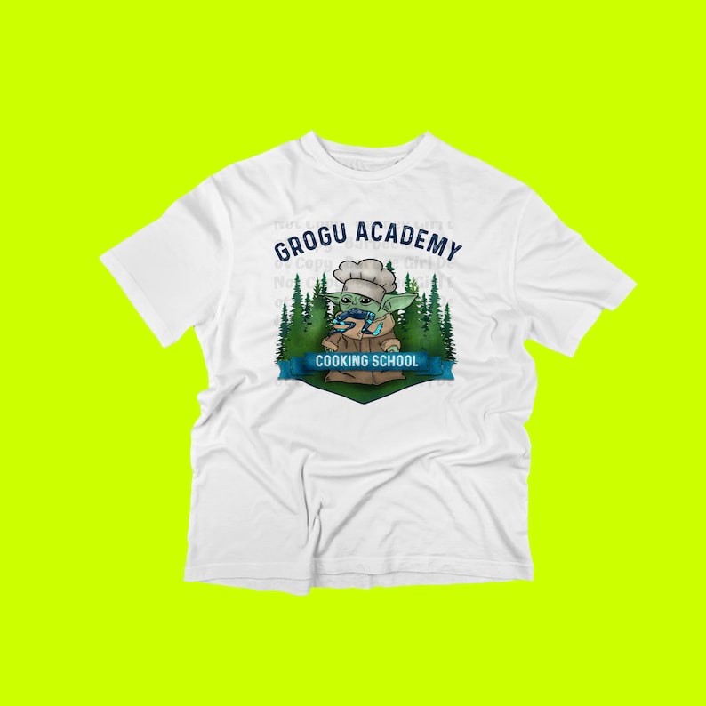 May include: White t-shirt with a green cartoon character wearing a chef's hat and holding a spoon. The text "Grogu Academy Cooking School" is printed on the shirt.