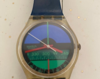 Reloj Swatch GK102 “Nautilus” vintage de 1986, funcionando, fabricado en Suiza, estilo retro, con caja transparente.