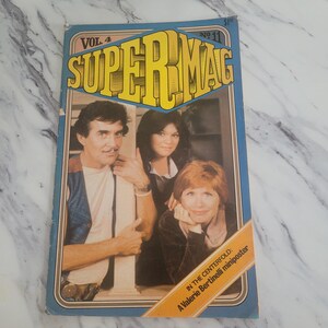 May include: A vintage Super Mag magazine, Vol. 4 No. 11, with a blue border and yellow block lettering. The cover features three people and the text "In the Centerfold: A Valerie Bertinelli miniposter".