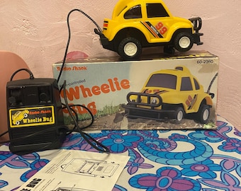 Auto radiocomandata vintage anni '80 "Wheelie Bug" di Radio Shack - con scatola e manuale - così com'è