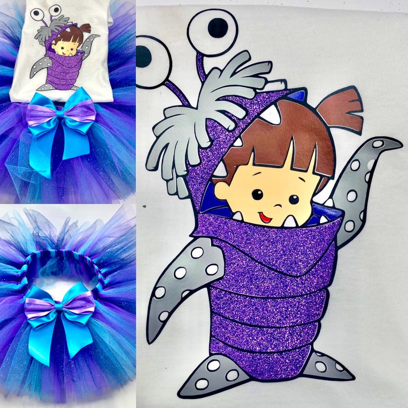 May include: A children's costume set featuring a white t-shirt with a cartoon graphic and a layered tulle skirt. The skirt is a mix of blue and purple with a large blue bow. The graphic is of a child in a purple monster costume.