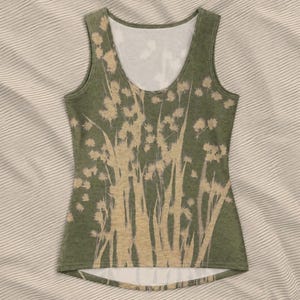 May include: Olive green tank top with a botanical design. The sleeveless top features a scoop neck and a beige floral pattern. The design includes tall, slender stems and delicate flower clusters, creating a natural, artistic look.