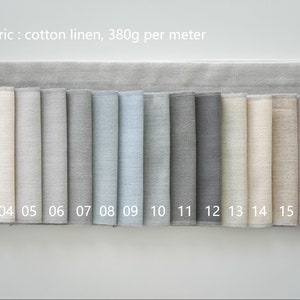 May include: A swatch card displaying 19 different colours of cotton linen fabric. The fabric weighs 380 grams per metre. The swatches are numbered 01 to 19.