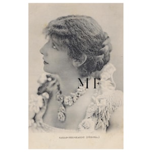 May include: Vintage black and white photograph of a woman in profile, wearing a decorative necklace and a detailed, ruffled collar. The image includes the text "MF" and "SARAH BERNHARDT (FÉDORA.)".