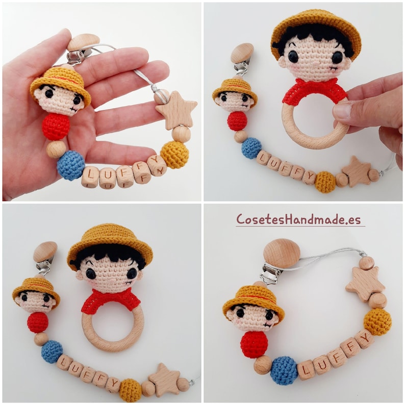 May include: A crocheted baby toy set featuring a character with a straw hat and red shirt. The set includes a teether, a rattle, and a clip-on toy with a wooden star and beads. The wooden beads are engraved with the name "LUFFY".