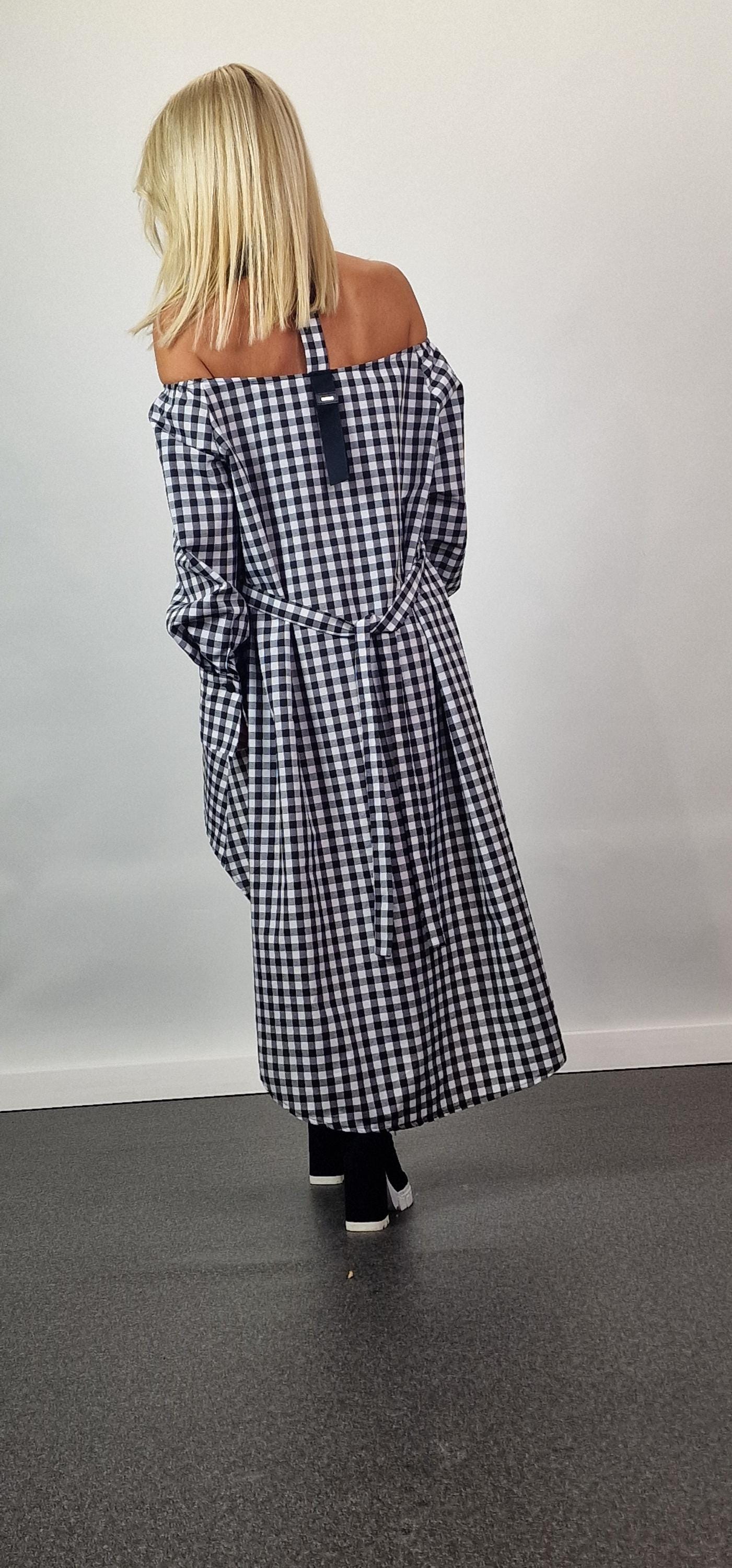 black and white gingham off the shoulder dress Revisit the charm of the 50s with this Lily Off-Shoulder Gingham Dress! From its full skirt to the classic black gingham print, it's retro style at its best #RetroFashion #VintageDreams #