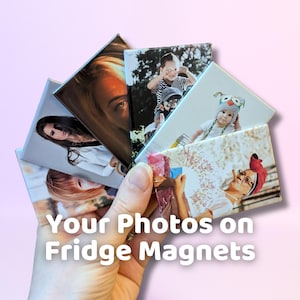May include: A hand holds a stack of square fridge magnets with different photos printed on them. The text "Your Photos on Fridge Magnets" is printed on the bottom of the image.
