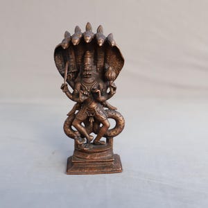 Cooper statue of Narsimha four handed shesh naag protecting  standing position blessing Mode