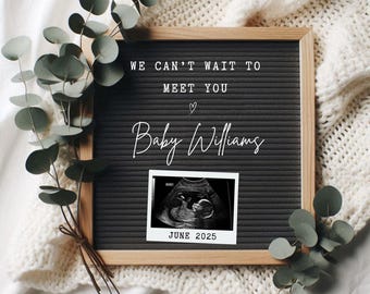 May include: A black letter board with white letters spelling "We can't wait to meet you Baby Williams" with a heart symbol and a black and white ultrasound image with the text "June 2025".