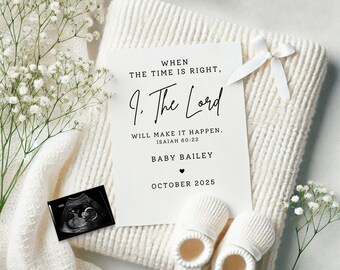May include: A white card with black text announcing the arrival of a baby named Bailey in October 2025. The text reads "When the time is right, The Lord will make it happen. Isaiah 60:22."  The card is surrounded by white baby booties, a white blanket, and white flowers.