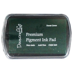 May include: A Dovecraft Premium Pigment Ink Pad in Forest Green. The ink pad is non-toxic, acid free, and child safe.