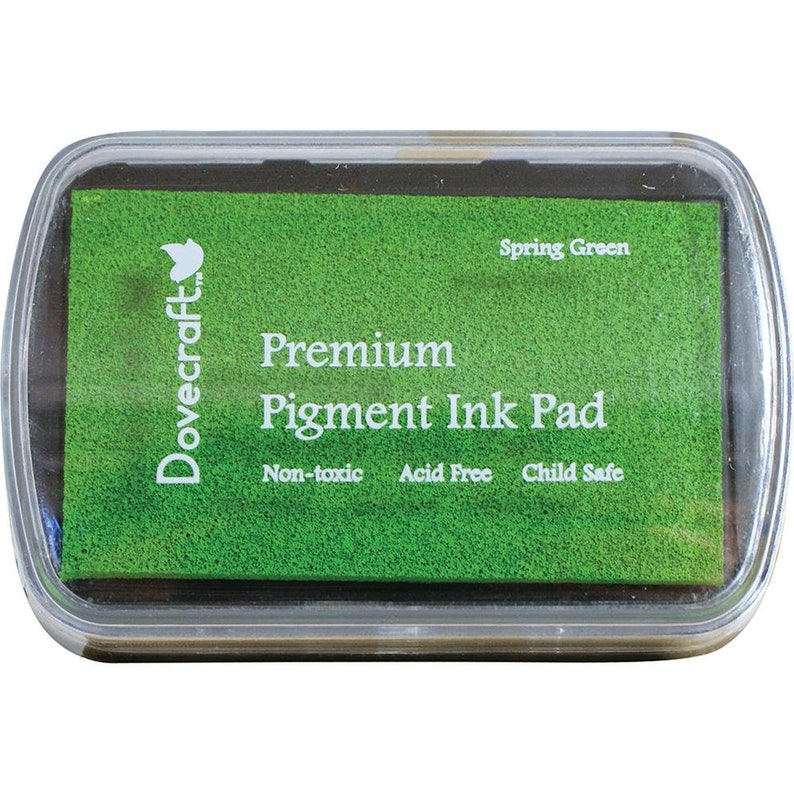 May include: A green Dovecraft Premium Pigment Ink Pad with the text "Spring Green" and "Non-toxic, Acid Free, Child Safe".