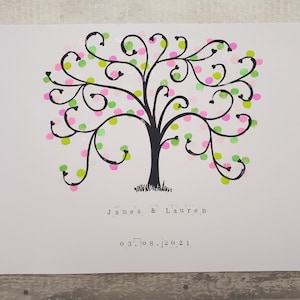 May include: A black and white tree with green and pink dots. The text "James & Lauren" and "03.08.2021" is below the tree.
