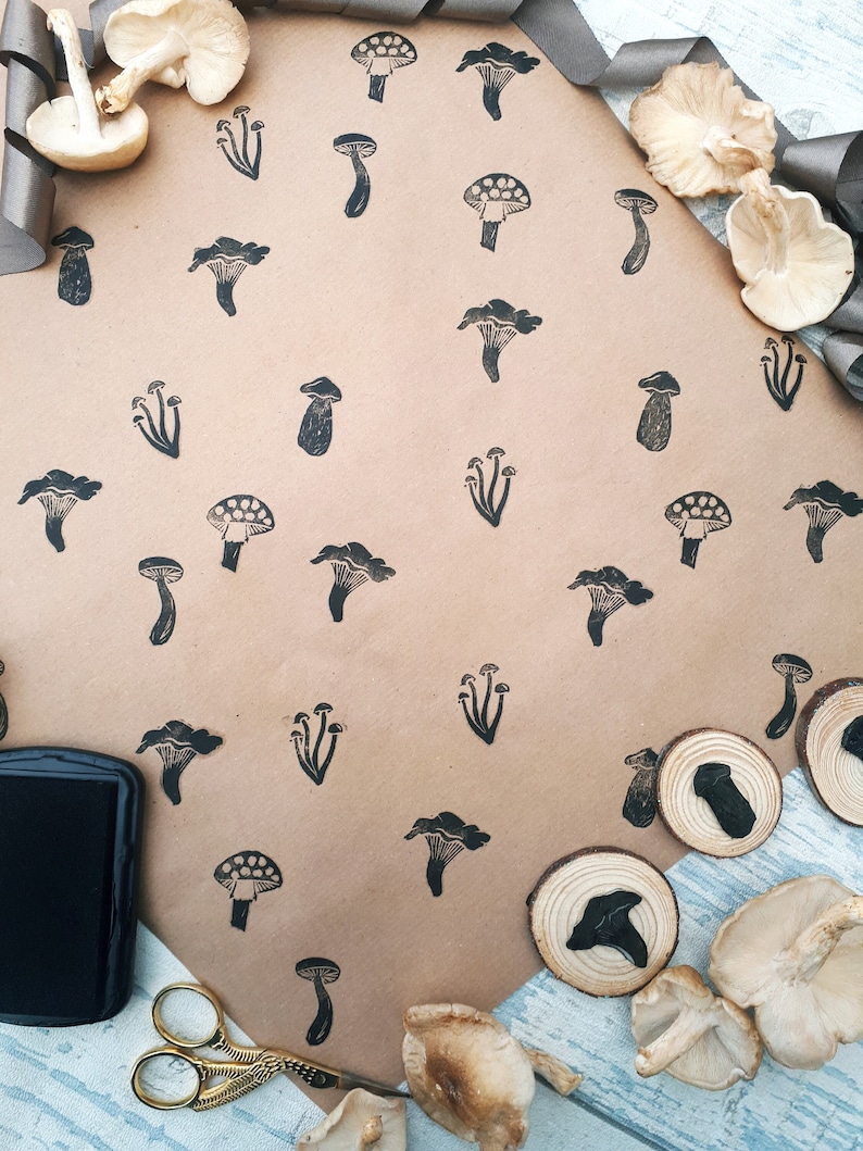 Beautifulhand carvedmushroom and toadstool ink stamps used with brown kraft paper to make unique gift wrapping paper