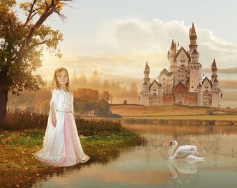 May include: A young girl in a white and pink dress stands in front of a lake with a white swan swimming in the water. A large white castle with red accents is in the background.