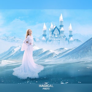 May include: A young girl in a white dress stands in a snowy landscape with a white castle in the background. The text "THE MAGICAL PHOTO" is at the bottom of the image.