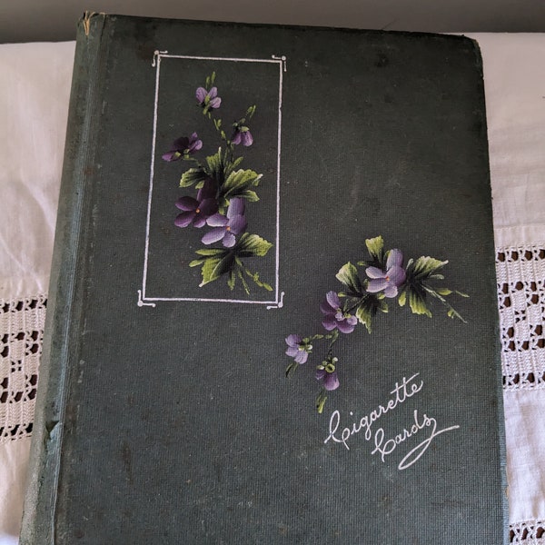 Cigarette card album decorated with violets and inscribed