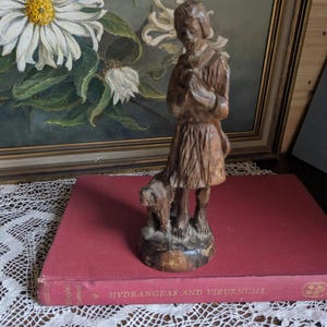 Carved wooden figure of the boy Jesus with a lamb - the Lord is my Shepherd