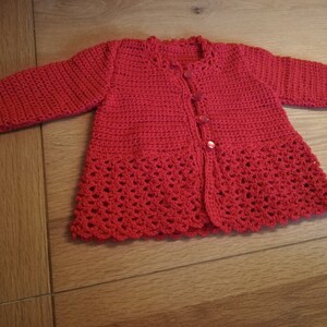 Red hand crocheted baby cardigan