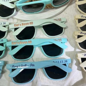 Blue sunglasses personalized sunglasses wedding gifts for guests bulk events sunnies destination wedding favors sage green customized shades baby shower gifts baby blue sky blue sunnies travel cruise cancun beach sunglasses dark blue sunglasses hotel giveaway gifts company running campaign golf soccer football sunglasses class of 2026 graduation gifts university school leavers grad gifts birthday gifts light teal shades aqua quinceanera sunglasses beige printed sunglasses sports summer gifts