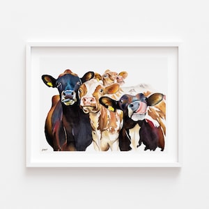 May include: A watercolor painting of four cows with different colored markings. The cows are looking directly at the viewer. The painting is framed in a white frame.
