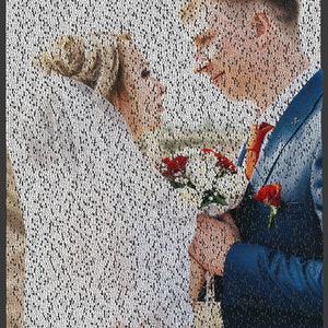 May include: A bride and groom are smiling at each other. The bride is wearing a white dress and the groom is wearing a blue suit. They are holding a bouquet of red roses.