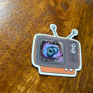 All seeing TV holographic sticker