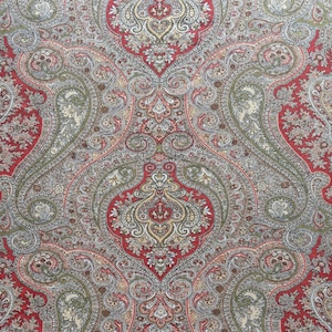 May include: A detailed, symmetrical paisley pattern in shades of red, gray, green, and cream. The design features large, ornate teardrop shapes and floral motifs, creating a rich and complex textile design.