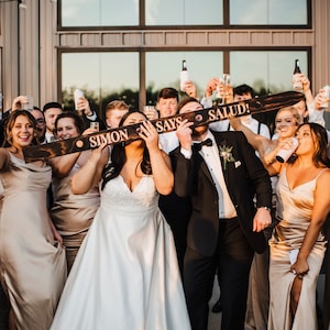 Looking for the perfect wedding gift? Our customized wood shot skis are handmade, engraved, and blowtorched to order. You choose the fonts, wording, and logos/monogram and we take care of the rest!  Get THE BEST wedding day pictures!