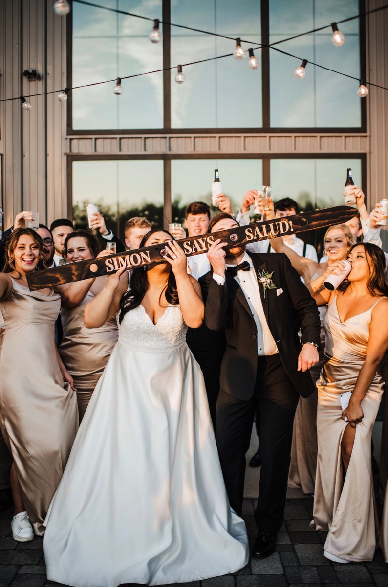 Looking for the perfect wedding gift? Our customized wood shot skis are handmade, engraved, and blowtorched to order. You choose the fonts, wording, and logos/monogram and we take care of the rest!  Get THE BEST wedding day pictures!