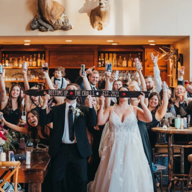 Looking for the perfect wedding gift? Our customized wood shot skis are handmade, engraved, and blowtorched to order. You choose the fonts, wording, and logos/monogram and we take care of the rest!  Get THE BEST wedding day pictures!