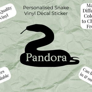May include: A black vinyl decal sticker in the shape of a snake with the name Pandora printed in white across the body. The text reads: Personalised Snake Vinyl Decal Sticker, High Quality Vinyl, Many Different Colours to Choose From, 6 Sizes Available, Can be used in & outside.