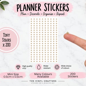 May include: A sheet of 200 gold-coloured star-shaped planner stickers, each measuring 0.5cm by 0.5cm. The text on the sheet reads PLANNER STICKERS, Plan - Decorate - Organise - Repeat, Tiny Stars x 200, High quality vinyl, Water resistant, Wide choice of colours, Mini Size 0.5cm x 0.5cm, Many Colours Available, 200 Stickers, and THE VINYL CRAFTERS STICKERS FOR A BRIGHTER DAY.