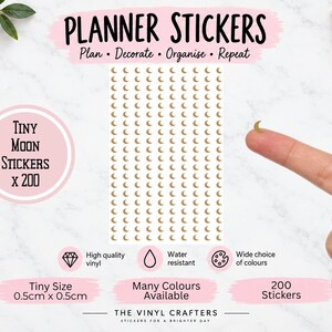 May include: A sheet of 200 tiny gold crescent moon planner stickers, each measuring 0.5cm by 0.5cm. The text reads PLANNER STICKERS, Plan - Decorate - Organise - Repeat, Tiny Moon Stickers x 200, High quality vinyl, Water resistant, Wide choice of colours.
