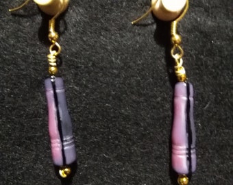 Purple and black dangle earrings.