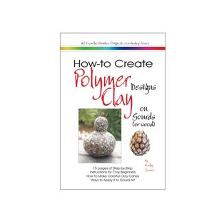 Puede incluir: Una portada de libro con un diseño de arcoíris colorido en la parte superior. El título es "How-to Create Polymer Clay Designs on Gourds (or wood)". La portada del libro presenta una calabaza decorada con arcilla polimérica y un primer plano de una calabaza más pequeña con diseños de arcilla polimérica.