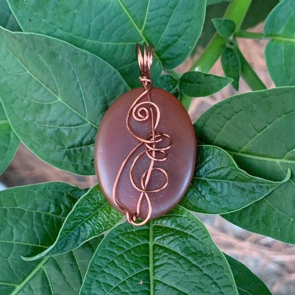 Brick Red Matte Glass wire wrapped pendant with copper wire. Cord included.